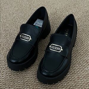 GUESS Black Leather Loafers with Gold Accent